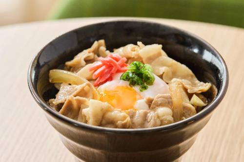 a bowl of food with an egg and noodles at Kobe Motomachi Tokyu REI Hotel in Kobe