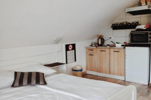 a room with two beds and a kitchen at Holiday Home Casa Rondo in Bihać