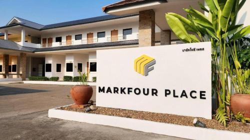 a sign for a marriott place in front of a building at Mark Four Place Hotel in Phrae