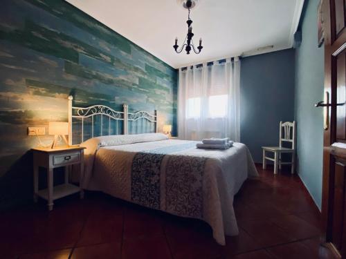 Katil atau katil-katil dalam bilik di Apartamentos El Ardinal