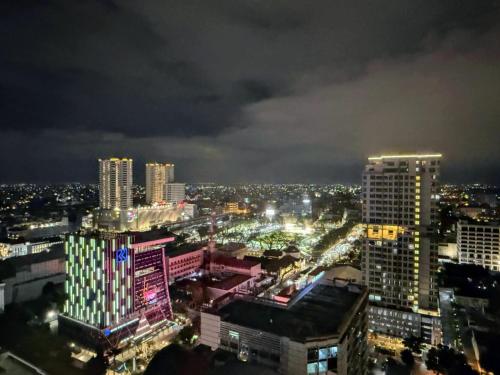 a view of a city at night with lights at Apartemen delipark tower lexington in Medan