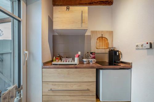 Kuchyň nebo kuchyňský kout v ubytování Bezauberndes Lütt Hus