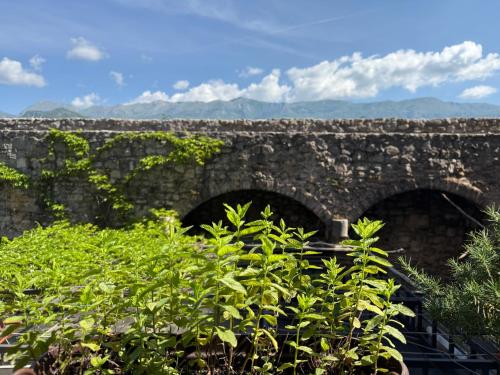 an old stone bridge with two arches at Apartments Aleksić Old Town in Budva
