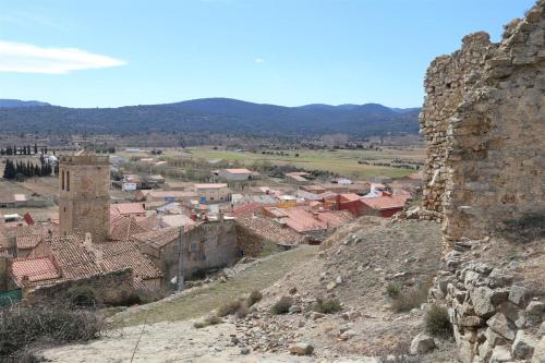 a view of a town from a castle at Hotel Rural Los Abriles in El Toro