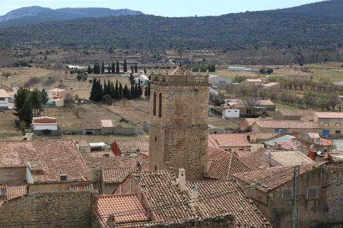 a view of a town with roofs and a tower at Hotel Rural Los Abriles in El Toro