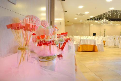 a room filled with tables with white tablesablish at Hotel Norat Marina & Spa 4* Superior in O Grove