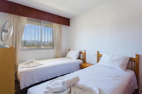 Ένα ή περισσότερα κρεβάτια σε δωμάτιο στο Karen Racons