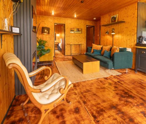 a living room with a couch and a table at Kingswood Lodges in Fort William