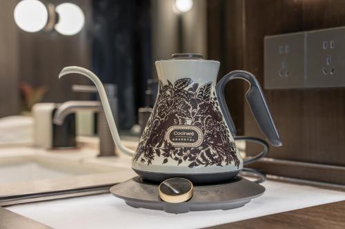 a tea kettle sitting on top of a counter at NOA Hotel Shanghai- Jing'an Temple in Shanghai