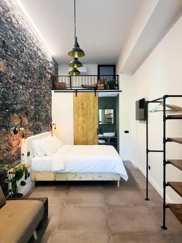 Ένα ή περισσότερα κρεβάτια σε δωμάτιο στο La Campanula