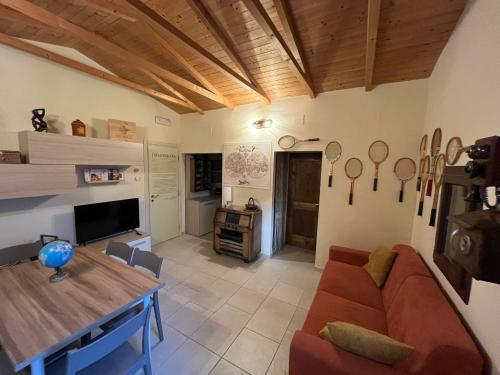 a living room with a couch and a table at Casa Vacanze Galileo in San Gregorio