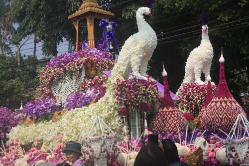 a display of chickens and flowers at a festival at Laph Kham House in Chiang Mai