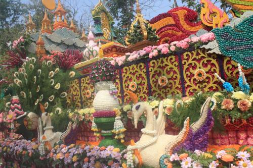 a display of flowers in front of a castle at Laph Kham House in Chiang Mai