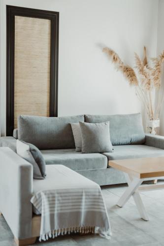 a living room with a couch and a table at Ktima Papadopoulou in Krionérion