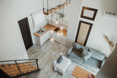 an overhead view of a living room with a blue couch at Ktima Papadopoulou in Krionérion