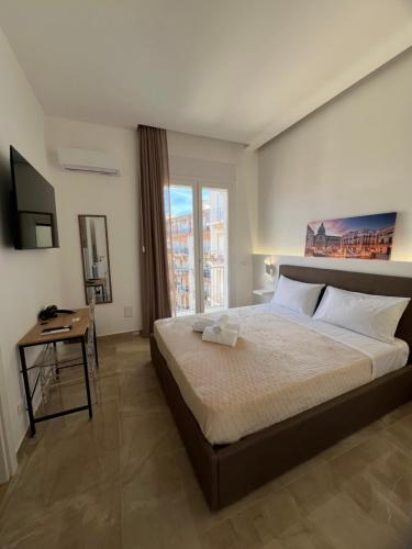 Postel nebo postele na pokoji v ubytování Isgró B&B