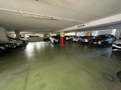 a parking garage filled with lots of parked cars at Hotel Costa Verde in Pineto