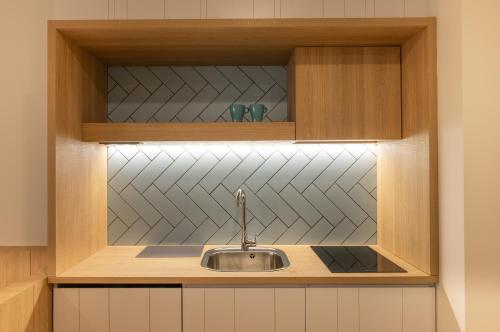 a kitchen with a sink in a cabinet at E16 - Estudio La Orotava in La Orotava