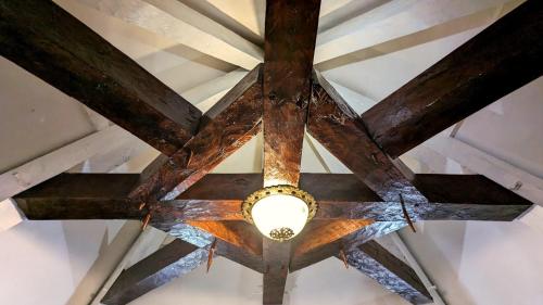 a ceiling fan with a light on it at Bonfarto Locations in Urval