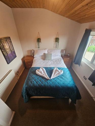 Ένα ή περισσότερα κρεβάτια σε δωμάτιο στο Cosy Coastal Lodge