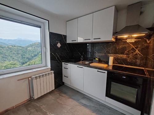 Η κουζίνα ή μικρή κουζίνα στο Apartments Stella Vittoria