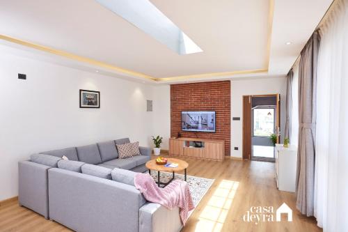 SK Apartments By Casadeyraにあるテレビまたはエンターテインメントセンター