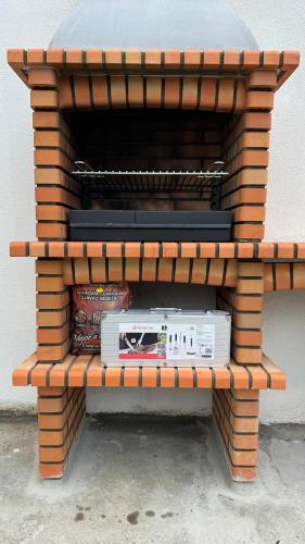 a wooden bench with a radio on it at Margarida Guest House - Rooms Lisbon South by Rosado in Almada