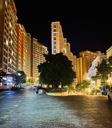 a city street at night with tall buildings at Sunset town Phú Quốc in Phu Quoc