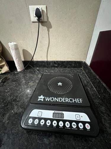 a remote control sitting on top of a counter at Apartment in Antarli in Mangrul