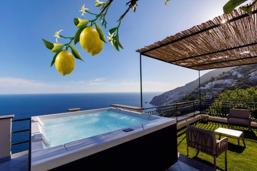 a villa with a plunge pool and a view of the ocean at Villa Le Porpore in Furore