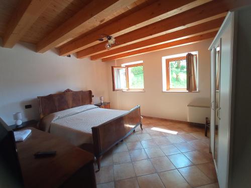 Postel nebo postele na pokoji v ubytování Agriturismo Corte Maccini