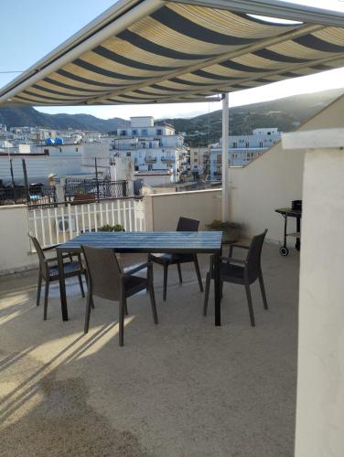 a table and chairs on a balcony with a view at Casa Ranieri in Mattinata