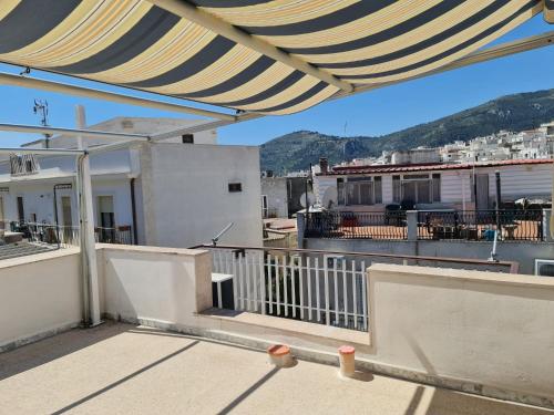 a balcony with a view of a city at Casa Ranieri in Mattinata