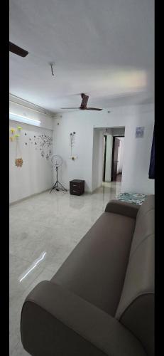 a living room with a couch and a table at Apartment in Antarli in Mangrul