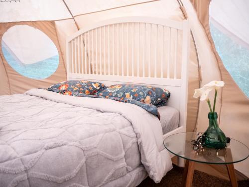 Postel nebo postele na pokoji v ubytování Glamping in Tuscany