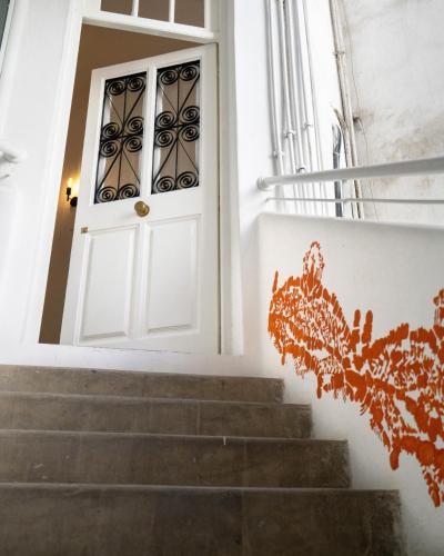 a white door with stairs in front at Appartements Balima Résidences Sidem in Rabat