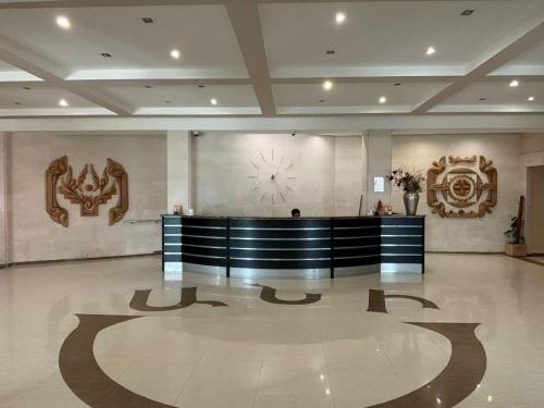 a lobby with a reception desk and a clock on the wall at Ani Resort in Artavaz