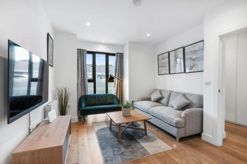 a living room with a couch and a table at Bright and Modern 3 bed Seaside escape sleeps 5 in Brighton & Hove