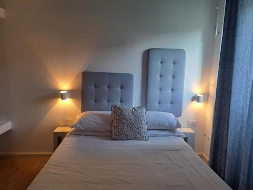 a bedroom with a bed with a pillow on it at Villa Aruch in Florence