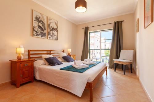 En eller flere senge i et værelse på B73 - Luz Sun Holiday Apartment