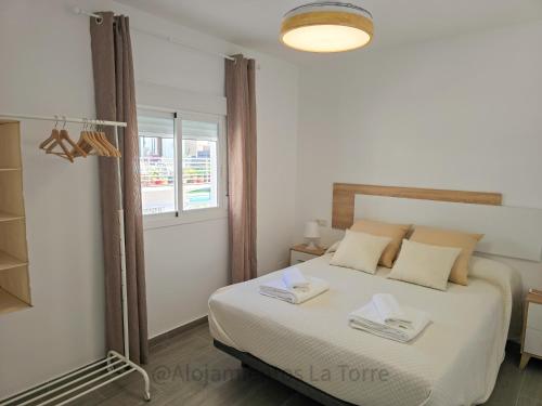 Postel nebo postele na pokoji v ubytování Casa Marenga - Alojamientos La Torre