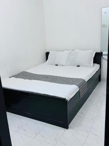 Postel nebo postele na pokoji v ubytování Hotel Ebraj Sylhet