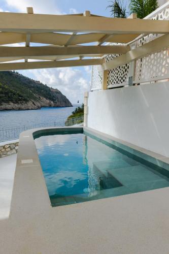 a swimming pool with a view of the water at AssosView in Asos