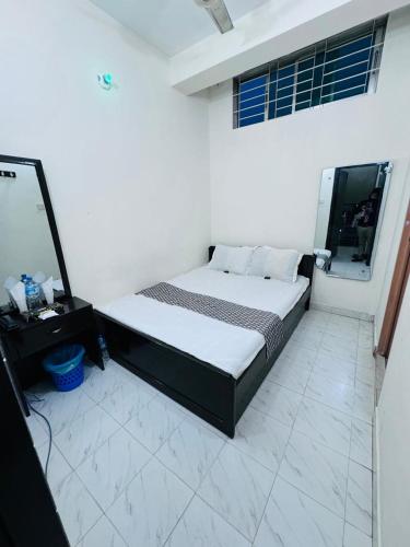Postel nebo postele na pokoji v ubytování Hotel Ebraj Sylhet