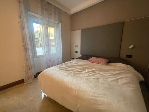 Ένα ή περισσότερα κρεβάτια σε δωμάτιο στο CasaFoscolo