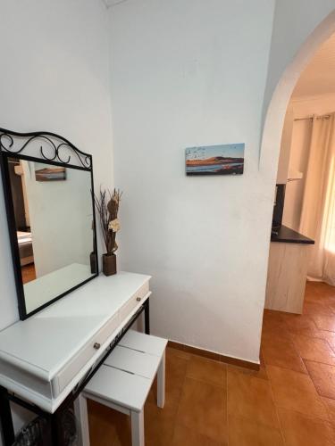 a dressing table with a mirror on top of it at Kassiopi Apartmets4you III in Kassiopi