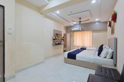 a bedroom with a bed in a room at The Castle Crown - Hotel Lord Krishna Dham in Dwarka