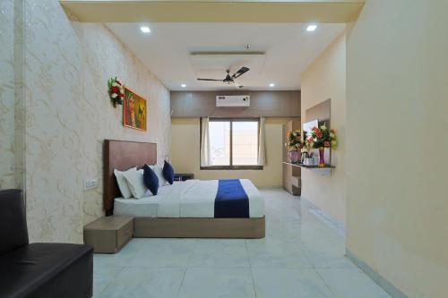 a bedroom with a large bed in a room at The Castle Crown - Hotel Lord Krishna Dham in Dwarka