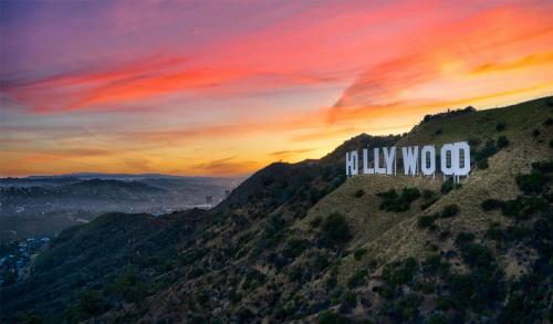 a painting of the hollywood sign on a mountain at Coast Burbank Hotel in Burbank