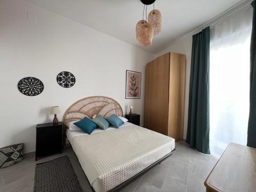 Postel nebo postele na pokoji v ubytování La casa dell'Artemisia